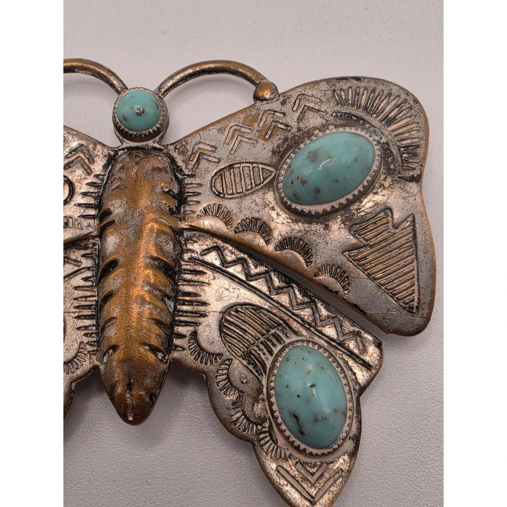 Undefined butterfly brooch